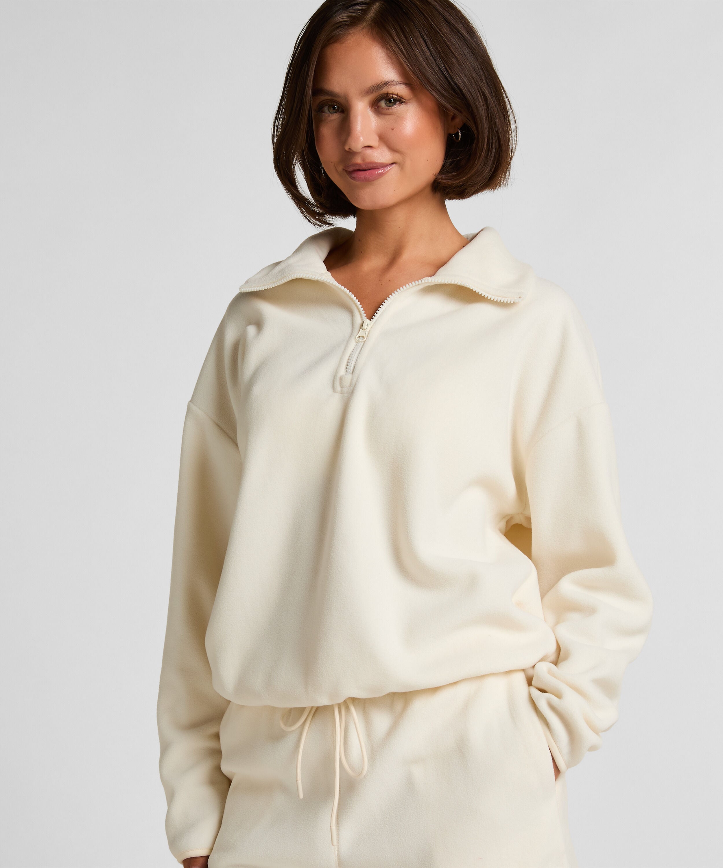 Sportliches Top aus Fleece mit halbem Reißverschluss, Weiß